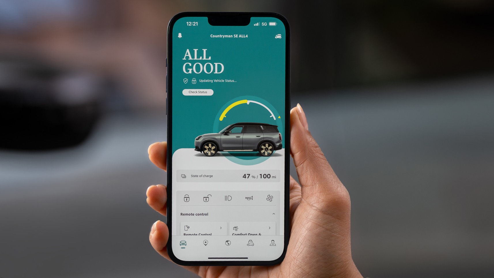 A woman standing next to a MINI